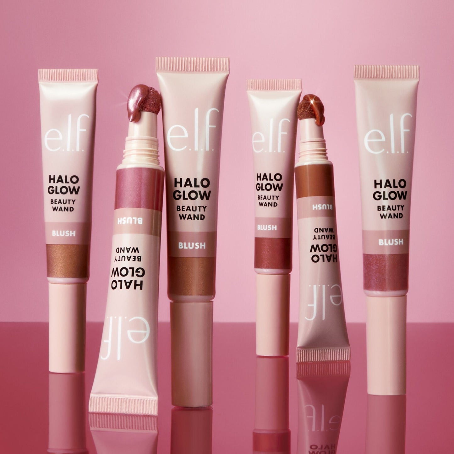 Set of e.l.f. Halo Glow Beauty Wands on a pink background